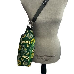 Green and Yellow swinging Oakland Athletics H20 Crossbody Bag.